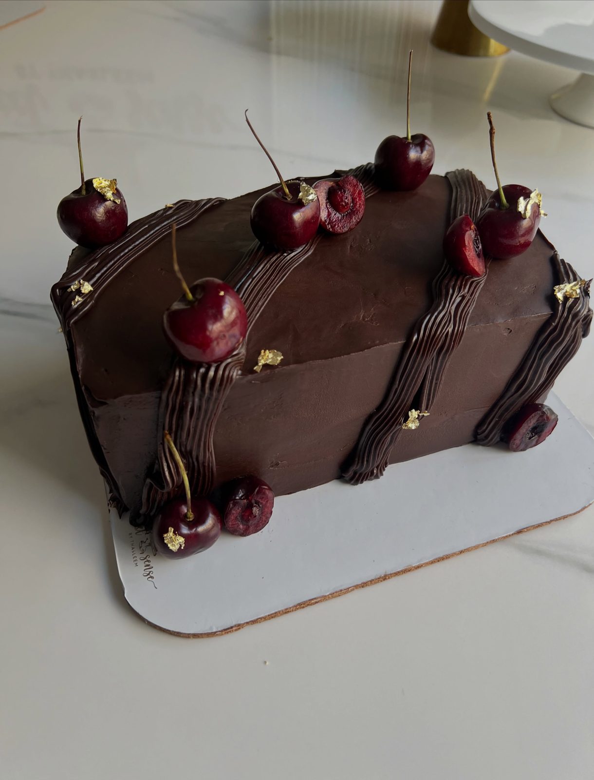 Chocolate cherry loaf cake with gold leaf